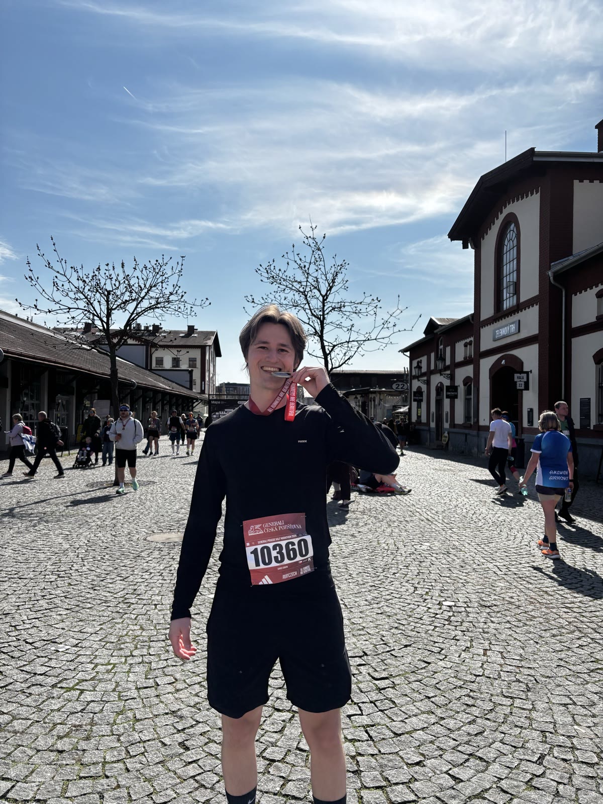 David holding his Prague Half Marathon medal